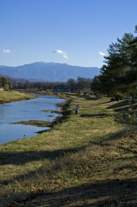 View of the Little Pigeon River in Sevierville with mountains in the background