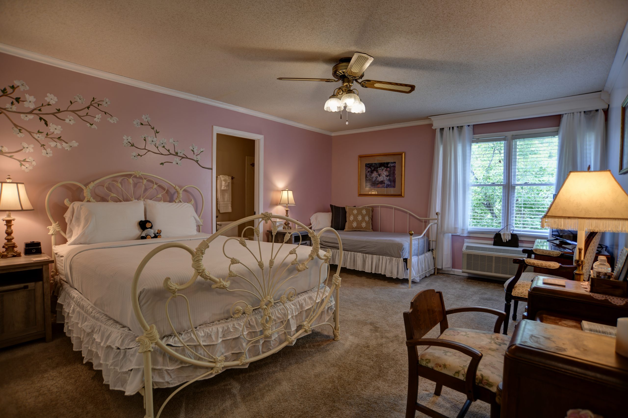 Ramsey Cascades room on the second floor. Pink and white room with elegant undertones and gray accents. A queen-sized bed and a twin.